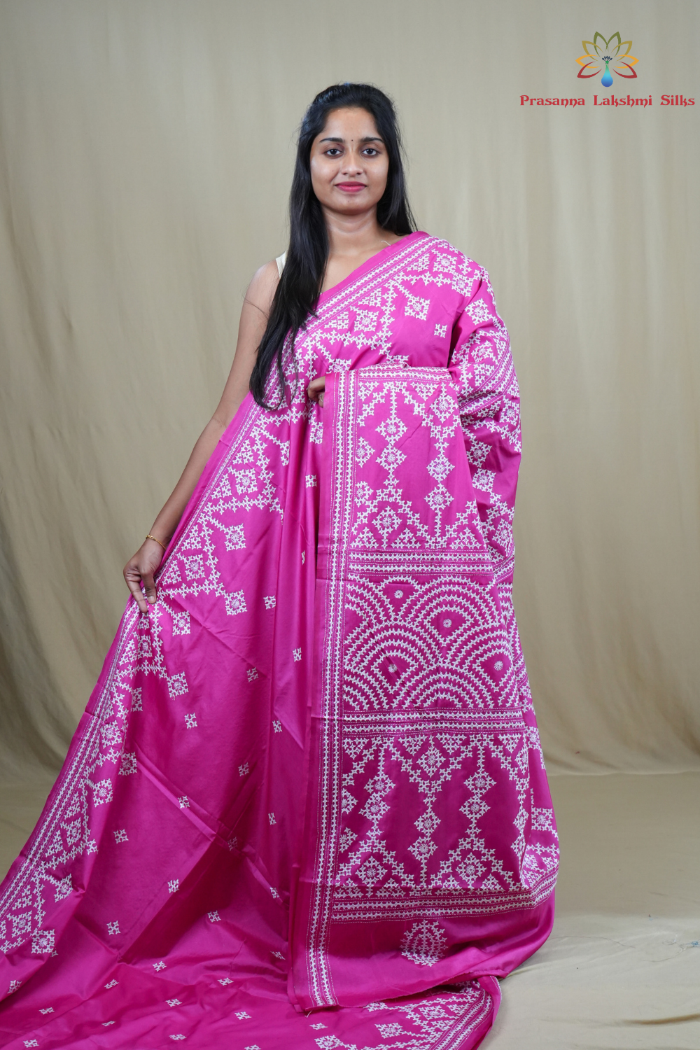 Semi Bangalore Silk Saree with all-over Kutch work motifs and rich embroidered pallu.
