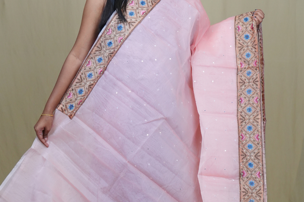 Traditional lightweight Organza Saree suitable for weddings and festive occasions with mirror work.