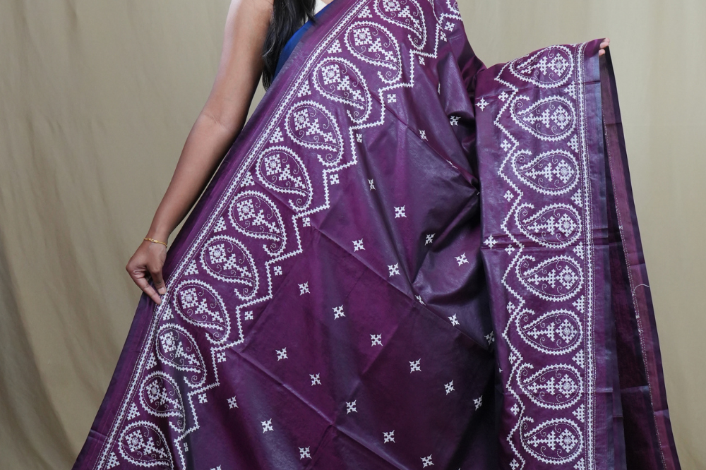 Traditional semi silk saree featuring beautiful hand Kutch work borders and artistic design.
