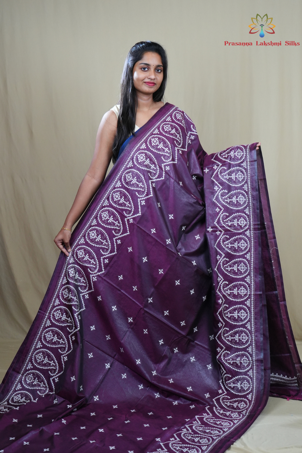 Traditional semi silk saree featuring beautiful hand Kutch work borders and artistic design.
