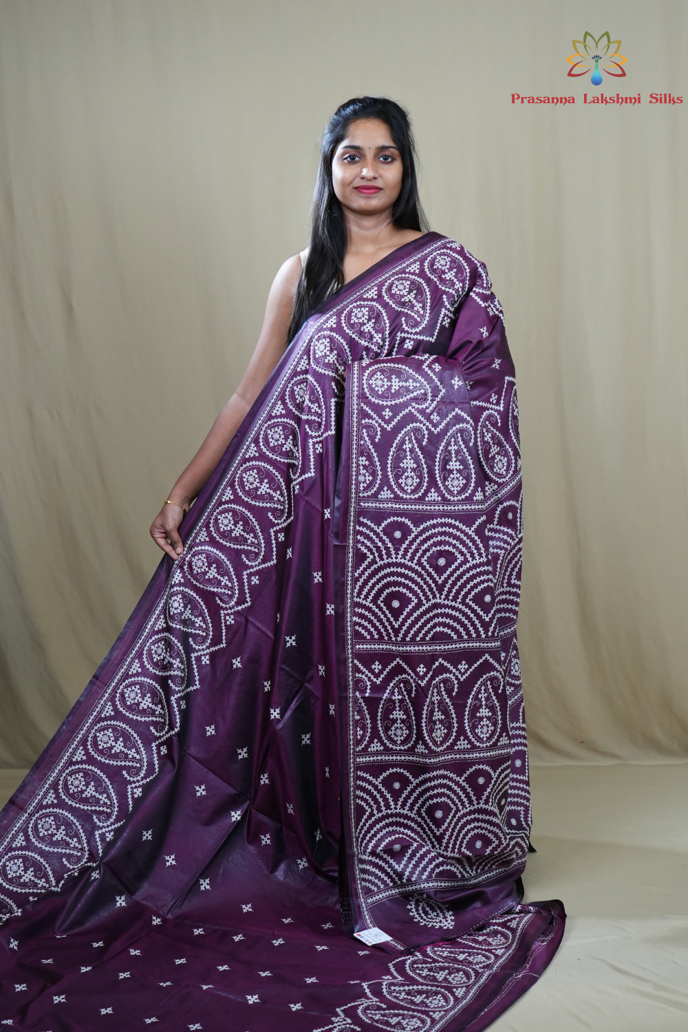 Semi Bangalore Silk Saree with all-over Kutch work motifs and rich embroidered pallu.
