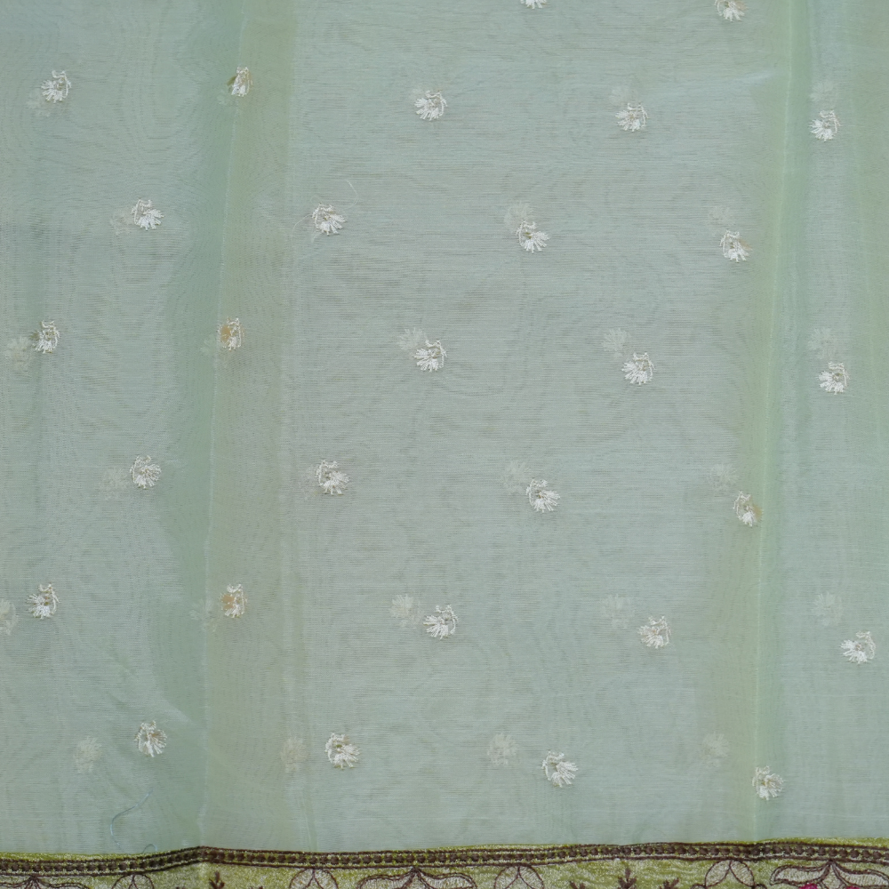 Elegant ethnic organza saree featuring floral pallu design and matching running blouse.
