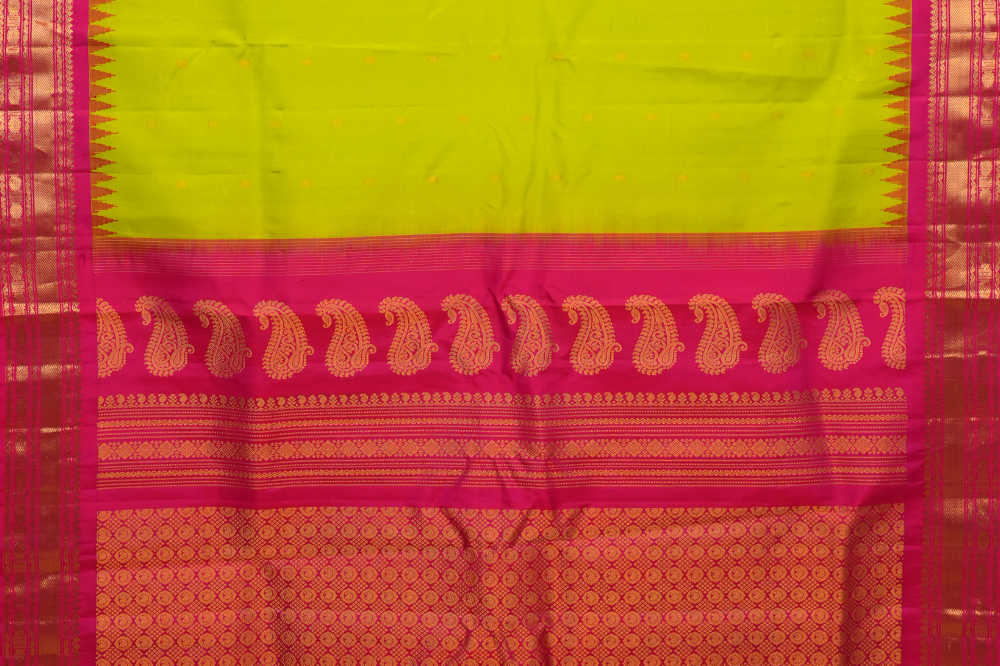 Handloom Gadwal pure silk saree with intricate small zari motifs and rich woven pallu.
