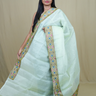 Organza Saree with all-over small mirror work and thread-woven tissue floral borders.
