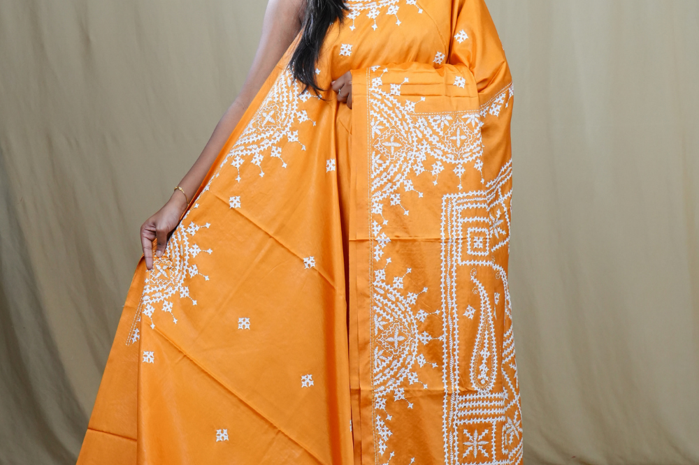 Semi Bangalore Silk Saree with all-over Kutch work motifs and rich embroidered pallu.
