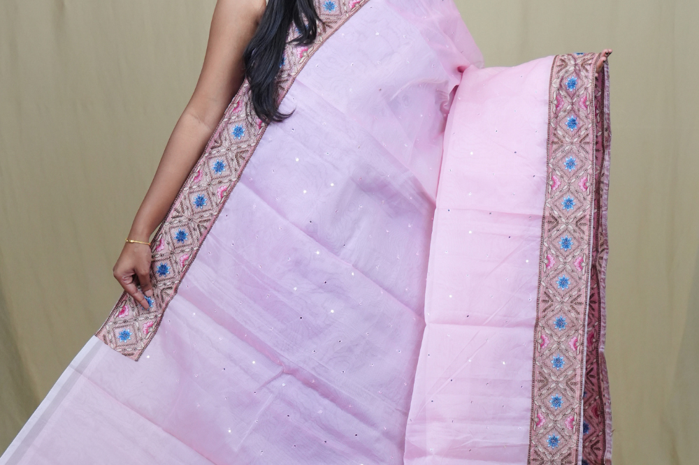 Traditional lightweight Organza Saree suitable for weddings and festive occasions with mirror work.