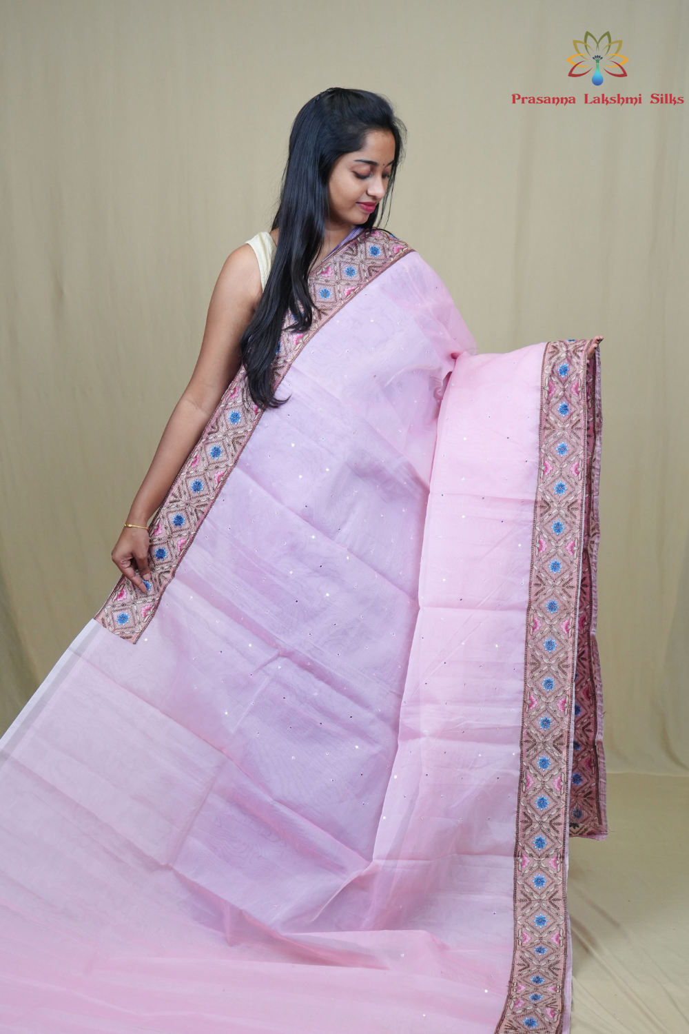Traditional lightweight Organza Saree suitable for weddings and festive occasions with mirror work.
