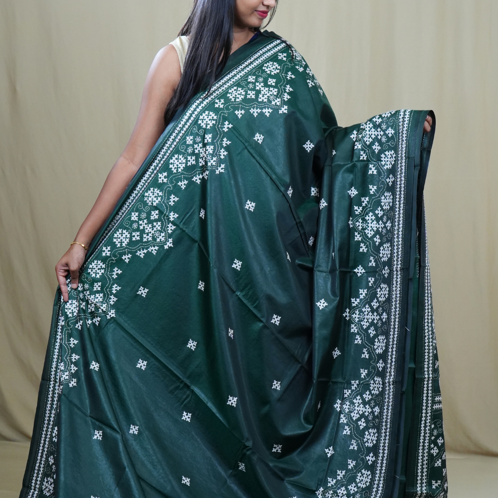 Traditional semi silk saree featuring beautiful hand Kutch work borders and artistic design.
