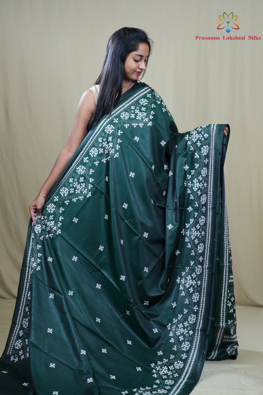 Traditional semi silk saree featuring beautiful hand Kutch work borders and artistic design.

