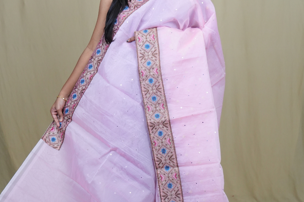 Organza Saree with all-over small mirror work and thread-woven tissue floral borders.
