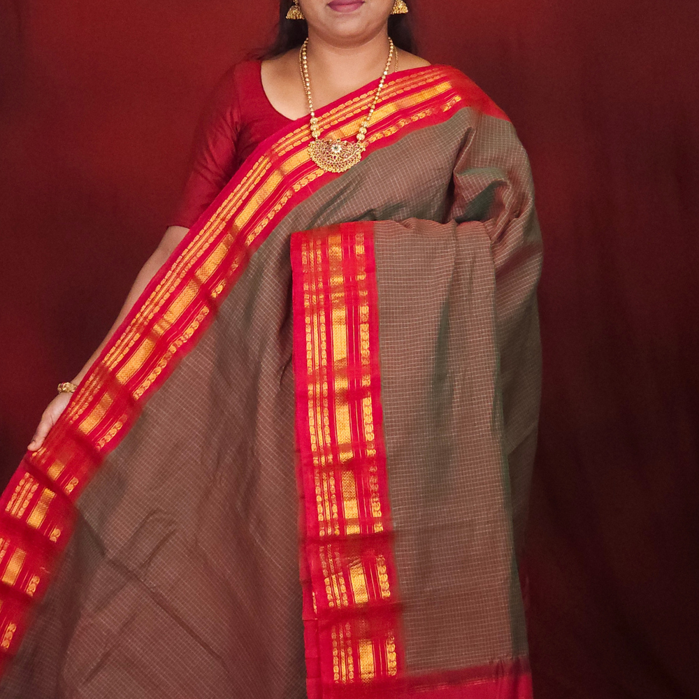 Lightweight Gadwal cotton saree featuring elegant zari border and striped pallu design.
