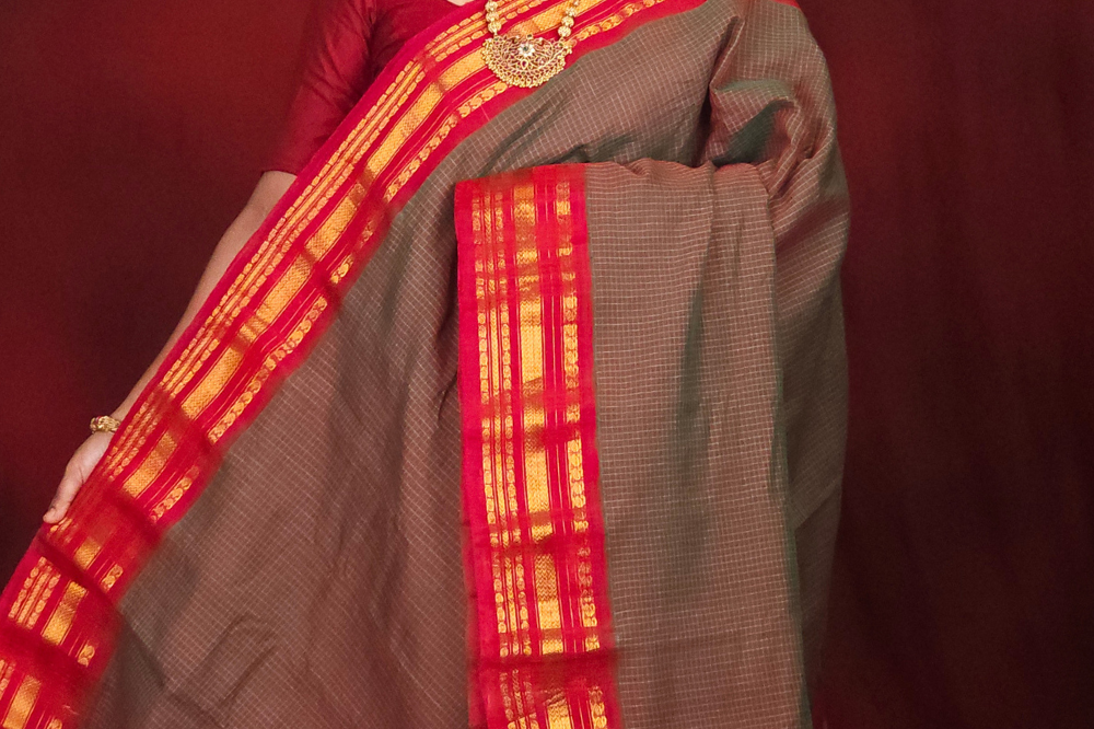 Lightweight Gadwal cotton saree featuring elegant zari border and striped pallu design.
