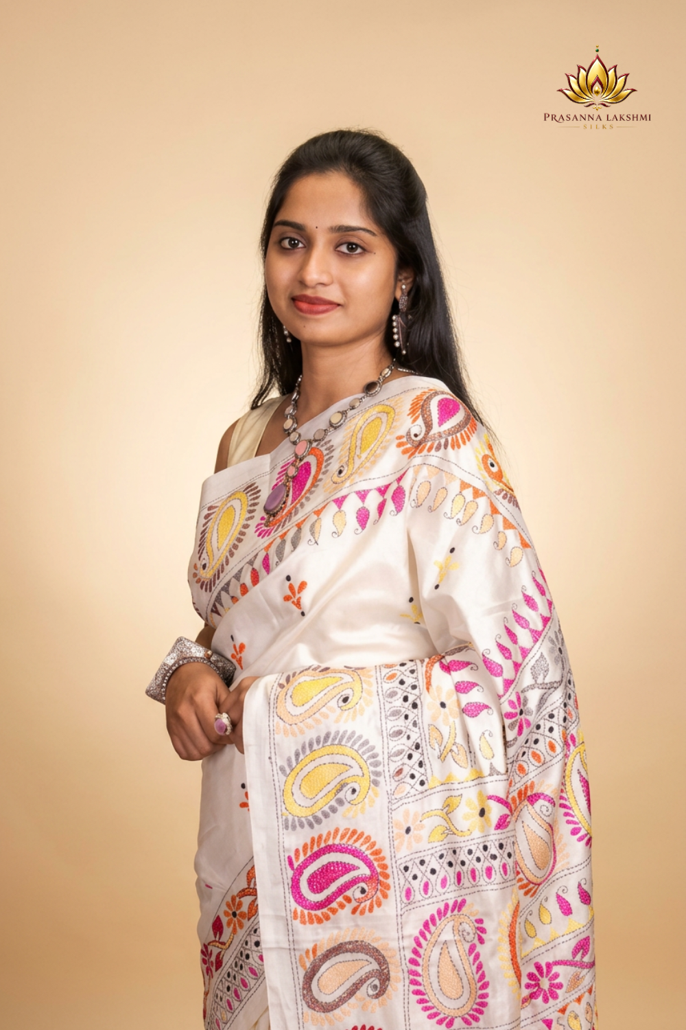 Elegant silk saree featuring Kantha work borders and detailed Kantha pallu design.
