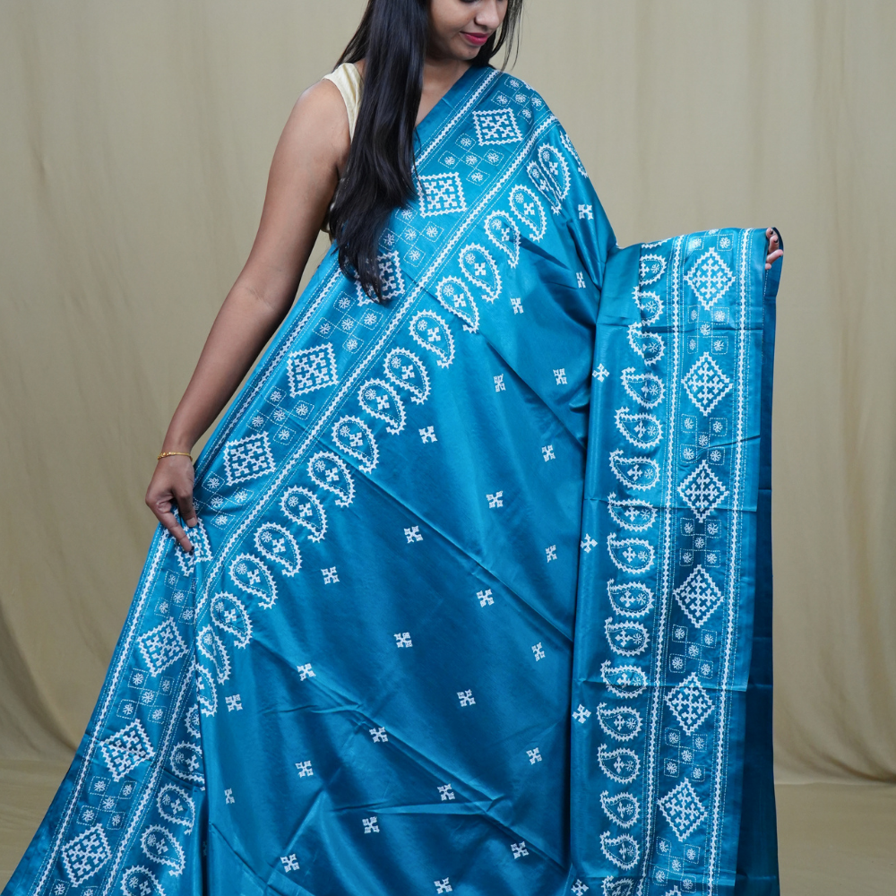 Traditional semi silk saree featuring beautiful hand Kutch work borders and artistic design.
