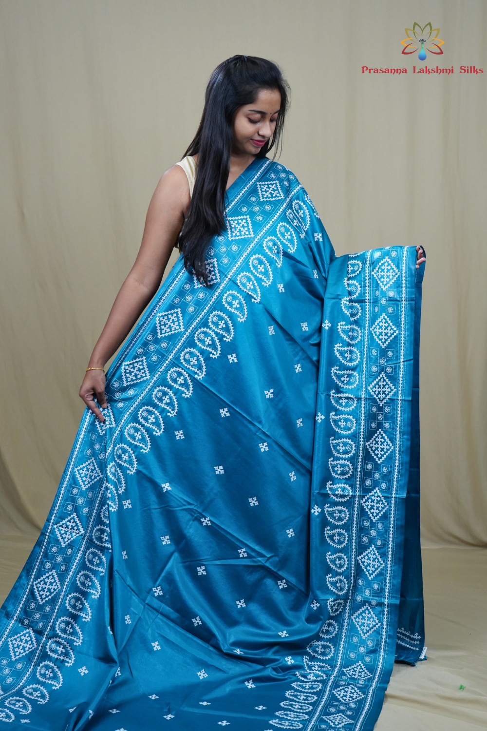 Traditional semi silk saree featuring beautiful hand Kutch work borders and artistic design.
