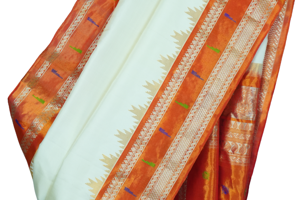Handloom Gadwal pure tissue silk saree with intricate zari motifs and muniya borders.
