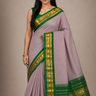 Pure handloom Gadwal cotton saree with traditional zari woven borders and simple zari stripes pallu.
