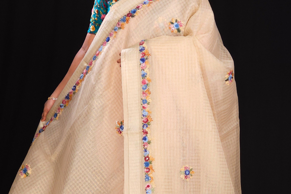 Cream Designer organza saree with embroidered borders