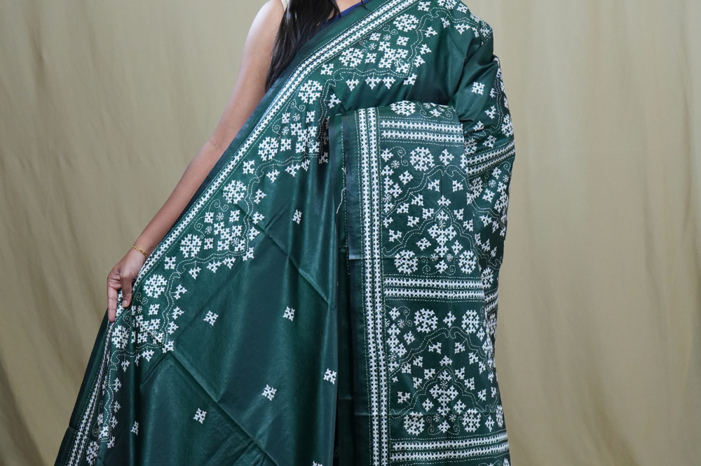 Semi Bangalore Silk Saree with all-over Kutch work motifs and rich embroidered pallu.
