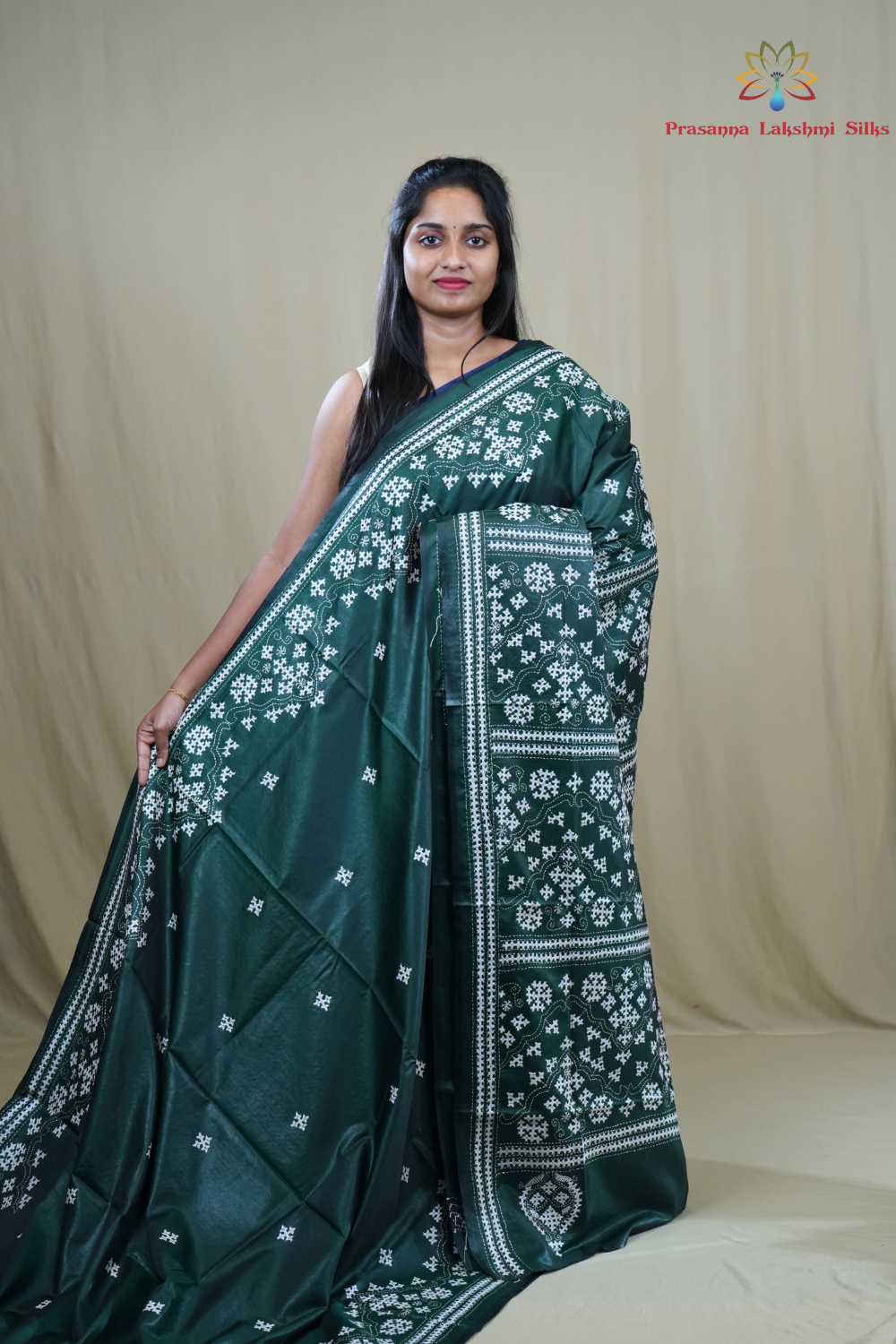 Semi Bangalore Silk Saree with all-over Kutch work motifs and rich embroidered pallu.
