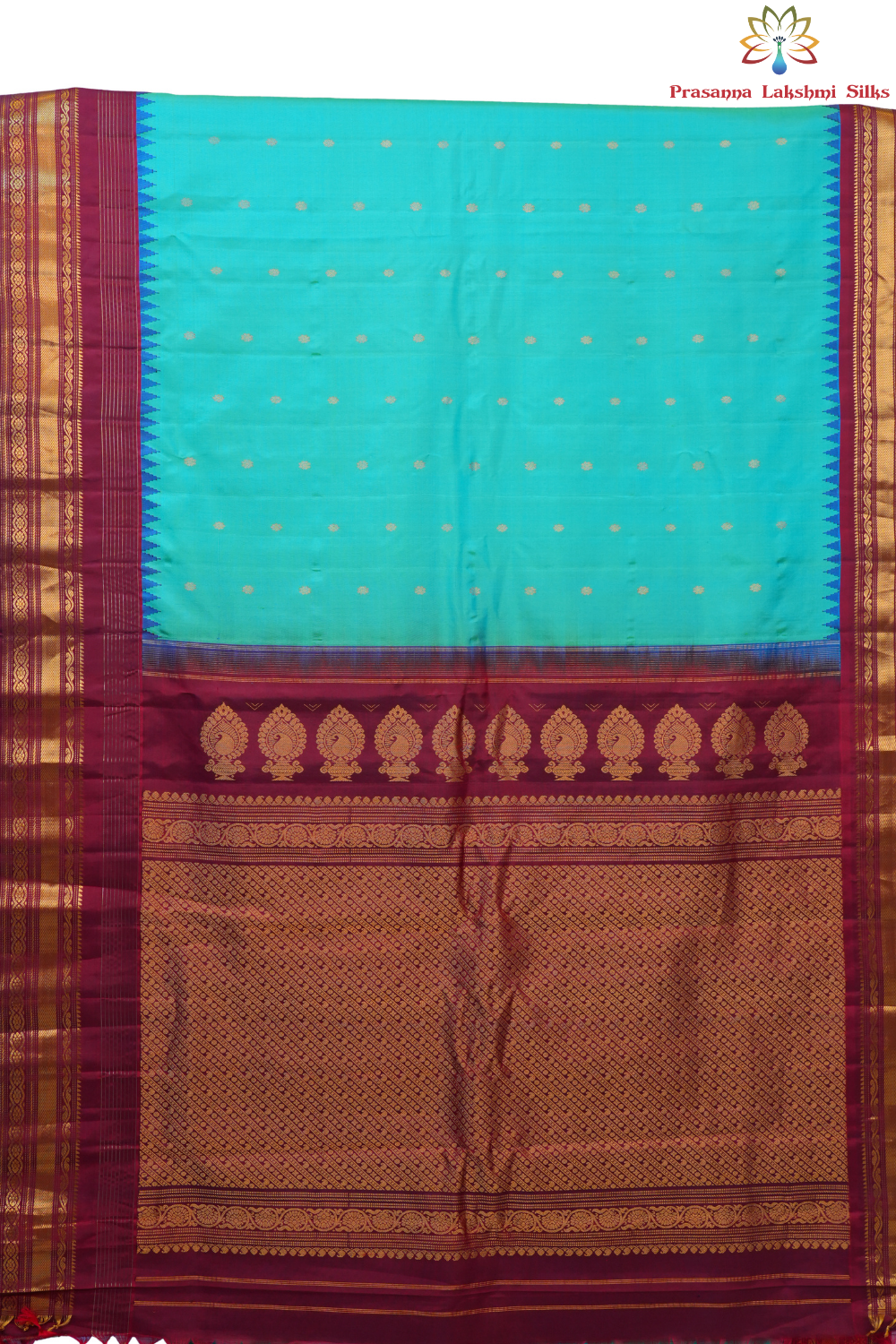 Handloom Gadwal pure silk saree with intricate small zari motifs and rich woven pallu.
