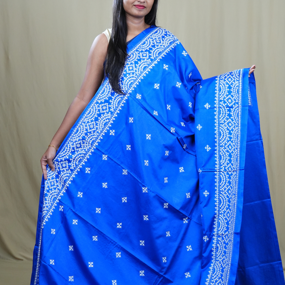Traditional semi silk saree featuring beautiful hand Kutch work borders and artistic design.
