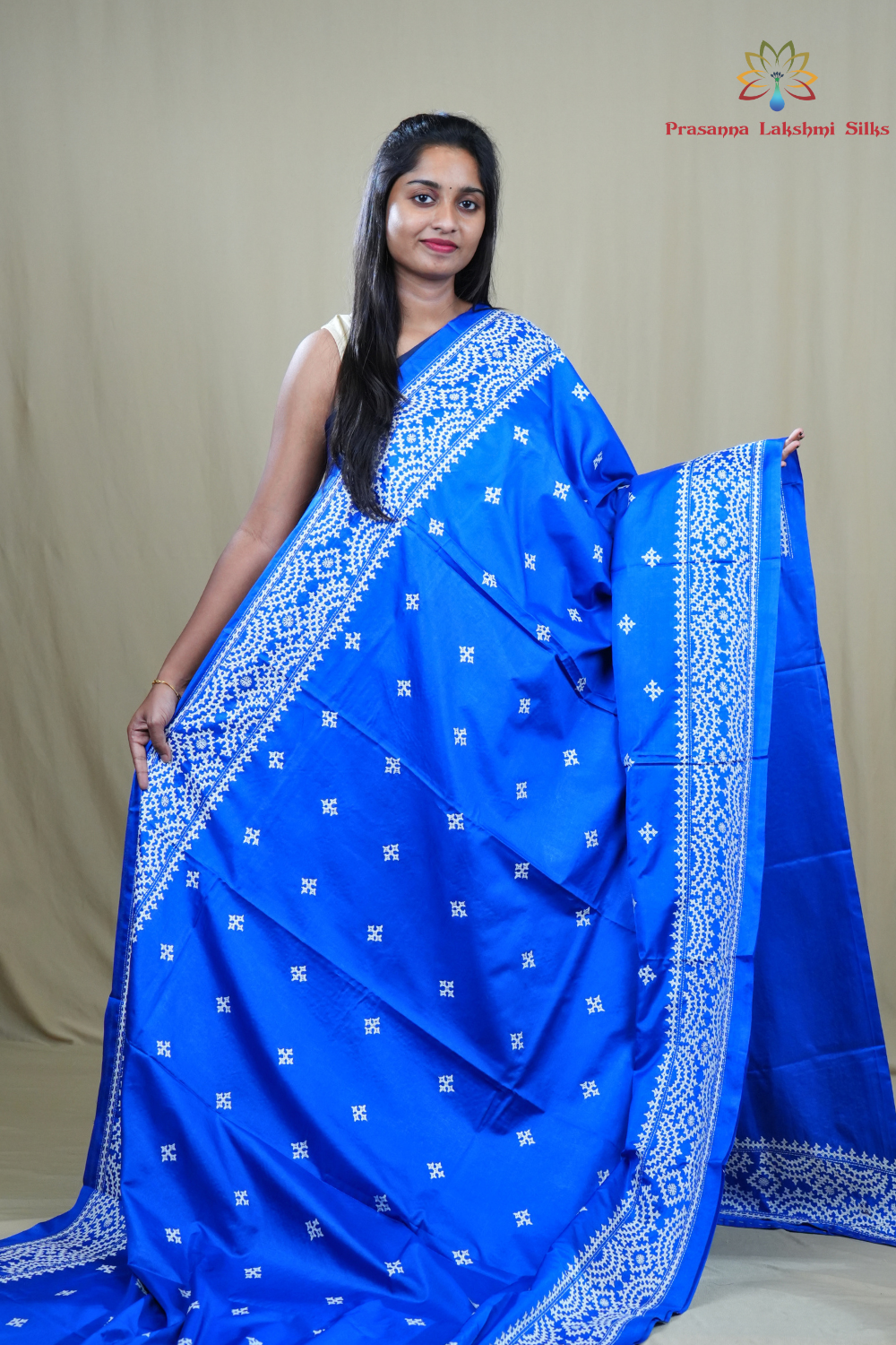 Traditional semi silk saree featuring beautiful hand Kutch work borders and artistic design.
