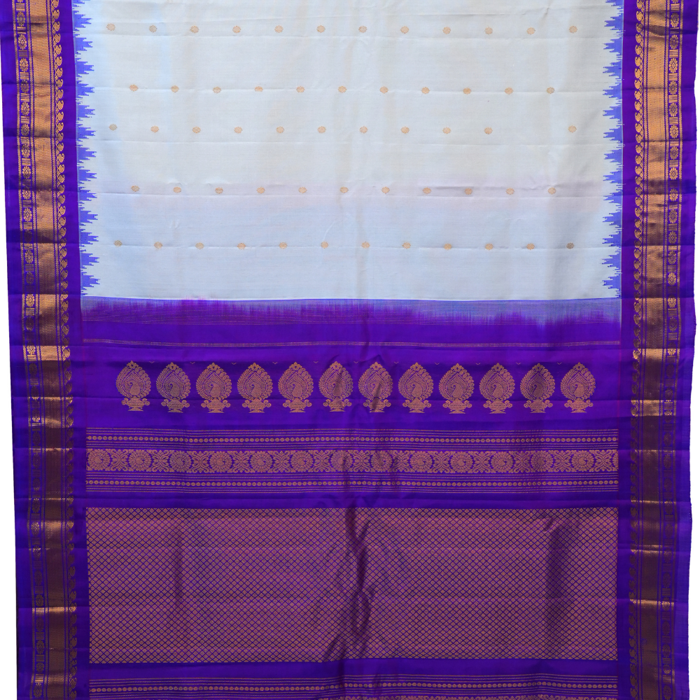 Handloom Gadwal pure silk saree with intricate small zari motifs and rich woven pallu.
