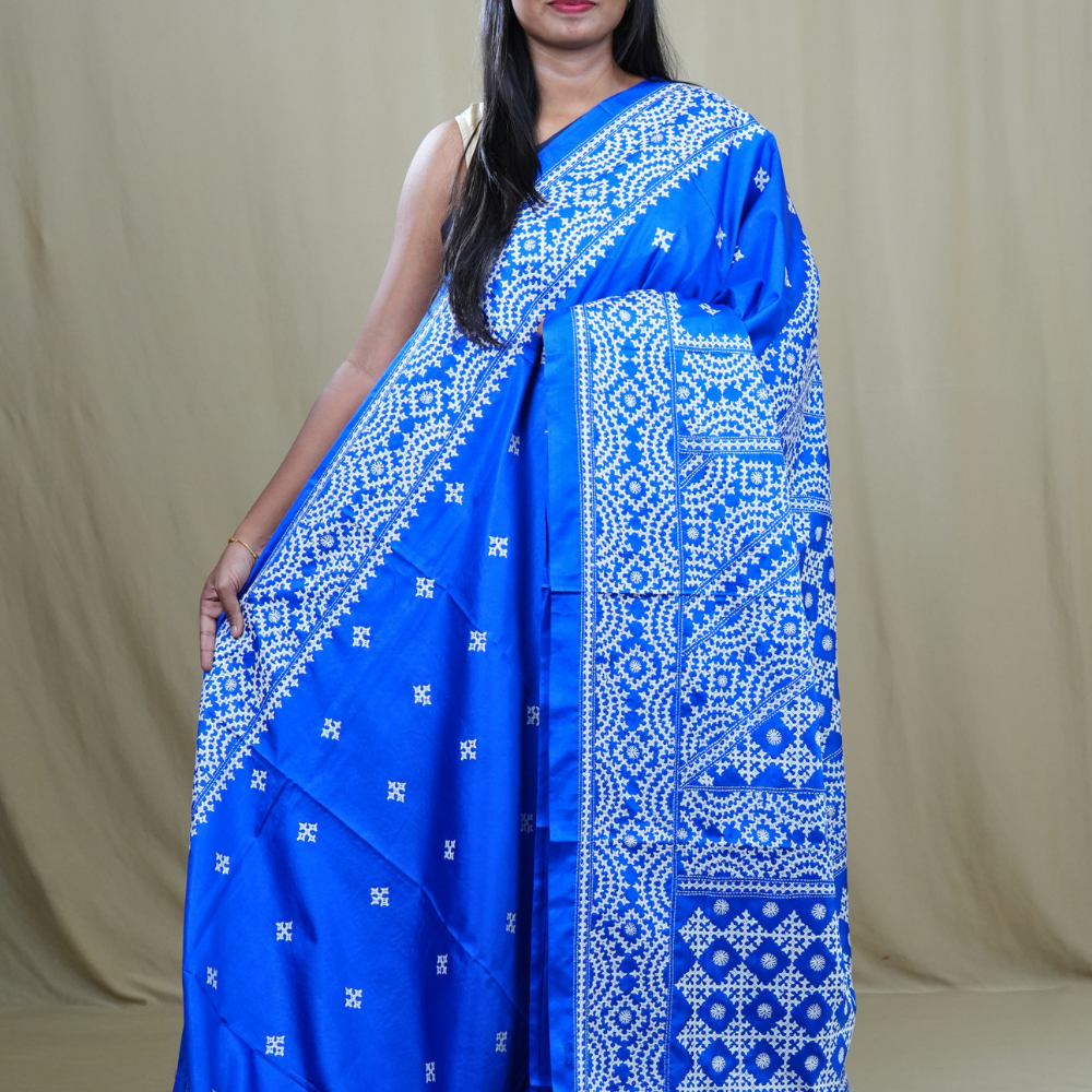 Semi Bangalore Silk Saree with all-over Kutch work motifs and rich embroidered pallu.
