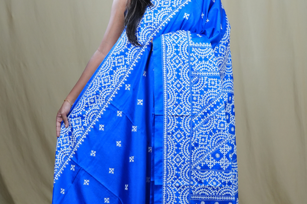 Semi Bangalore Silk Saree with all-over Kutch work motifs and rich embroidered pallu.
