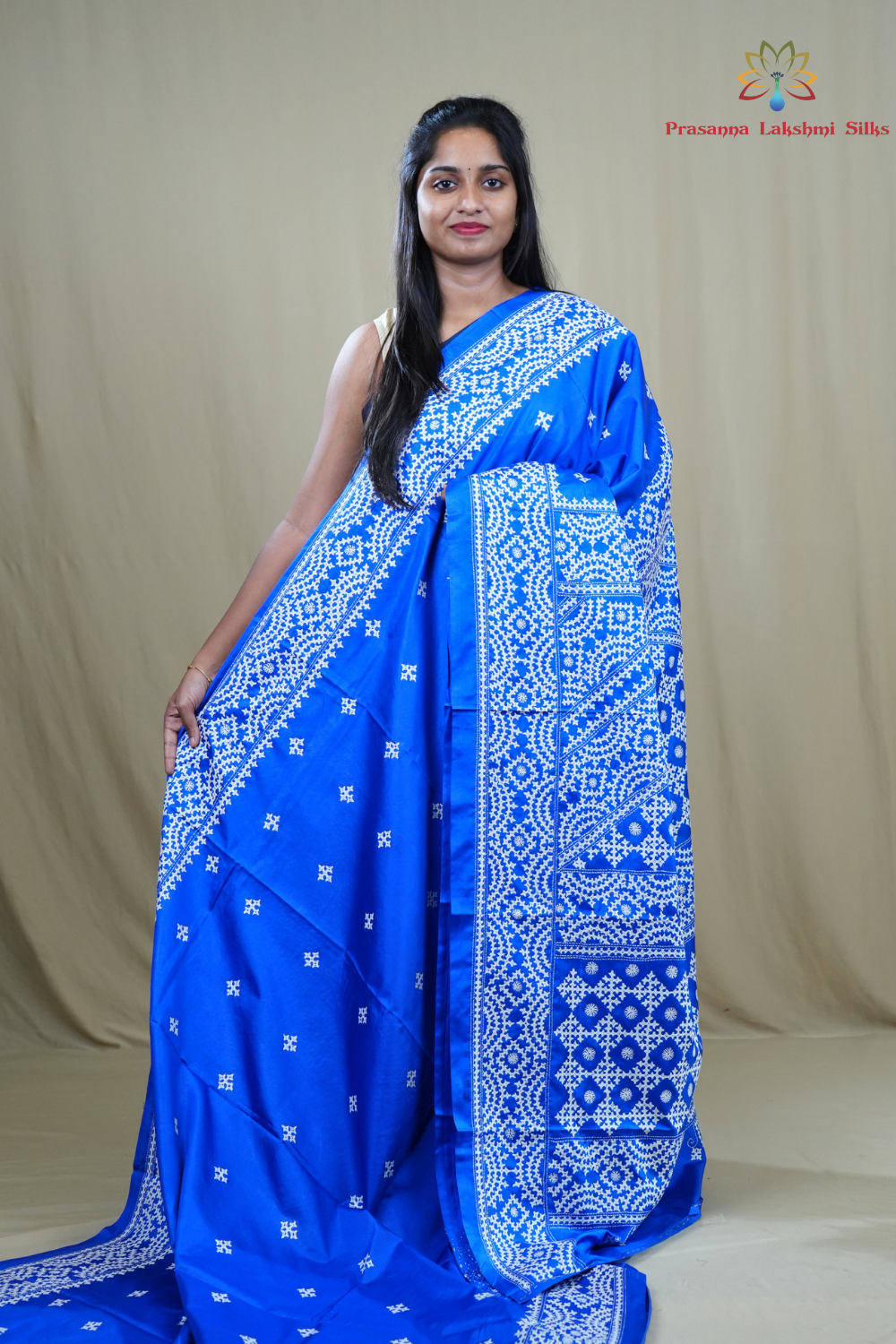 Semi Bangalore Silk Saree with all-over Kutch work motifs and rich embroidered pallu.
