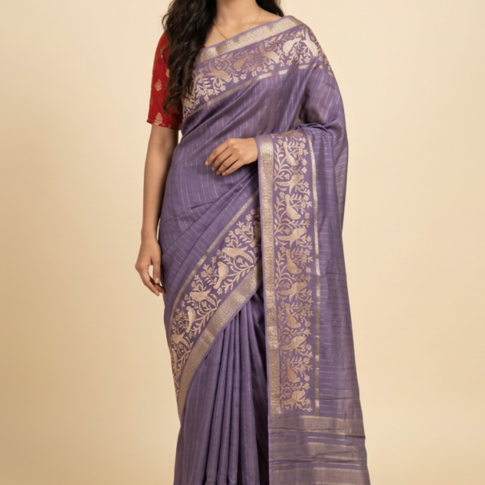 Chiniya Silk Saree with all-over zari woven vertical stripes, thread woven parrot floral border, tassel pallu, and contrast zari butta blouse.
