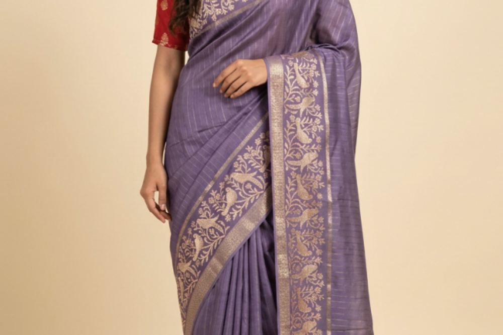 Chiniya Silk Saree with all-over zari woven vertical stripes, thread woven parrot floral border, tassel pallu, and contrast zari butta blouse.
