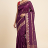 Banarasi Munga silk saree with all-over zari woven floral motifs and rich brocade pallu.
