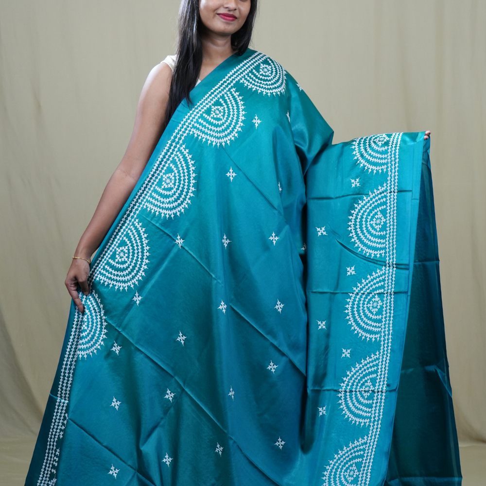 Traditional semi silk saree featuring beautiful hand Kutch work borders and artistic design.
