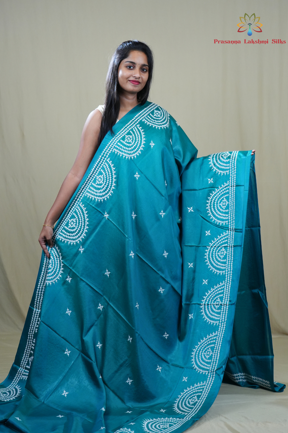 Traditional semi silk saree featuring beautiful hand Kutch work borders and artistic design.
