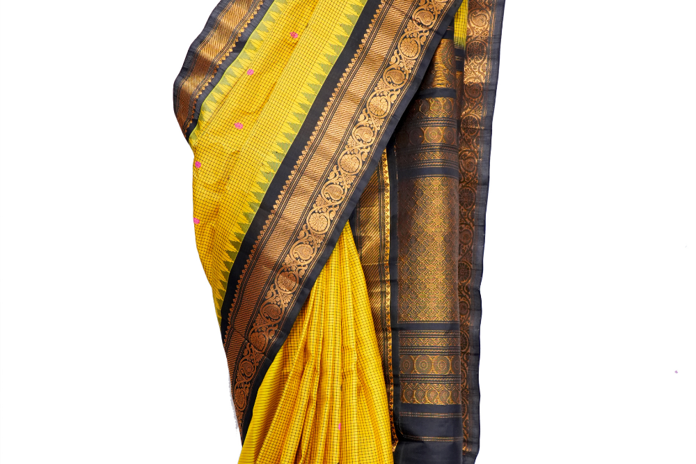 Handloom Gadwal pure silk saree with classic checks pattern and rich zari brocade pallu.
