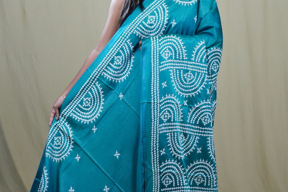 Semi Bangalore Silk Saree with all-over Kutch work motifs and rich embroidered pallu.
