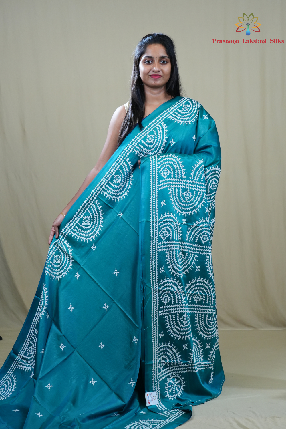Semi Bangalore Silk Saree with all-over Kutch work motifs and rich embroidered pallu.
