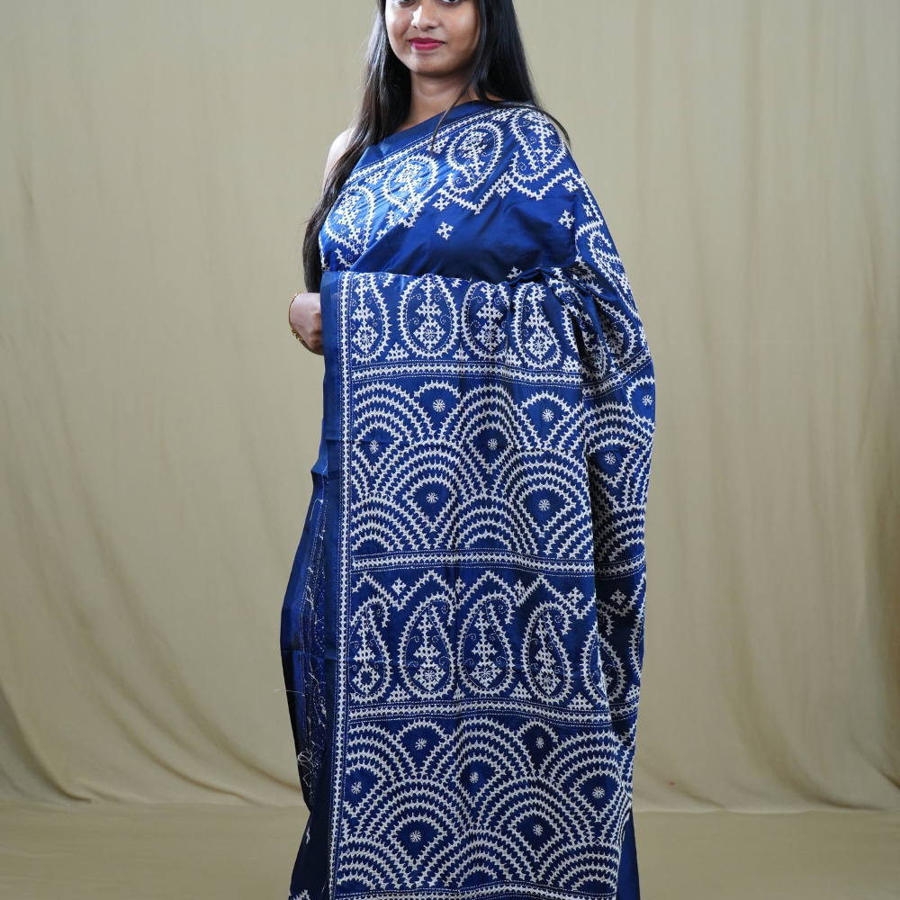 Traditional semi silk saree featuring beautiful hand Kutch work borders and artistic design.
