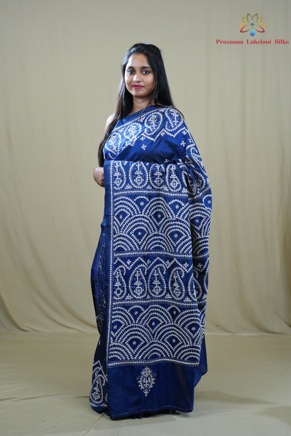 Traditional semi silk saree featuring beautiful hand Kutch work borders and artistic design.
