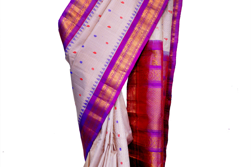 Handloom Gadwal pure silk saree with classic checks pattern and rich zari brocade pallu.
