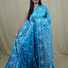 Semi Bangalore Silk Saree with all-over Kutch work motifs and rich embroidered pallu.

