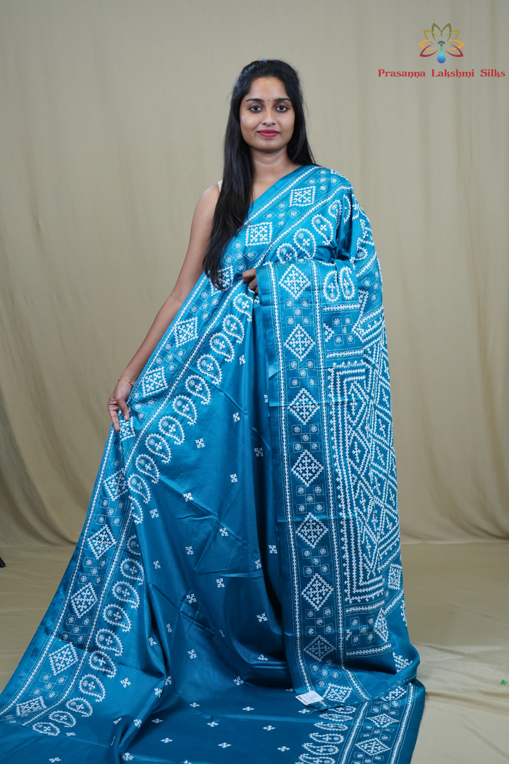 Semi Bangalore Silk Saree with all-over Kutch work motifs and rich embroidered pallu.
