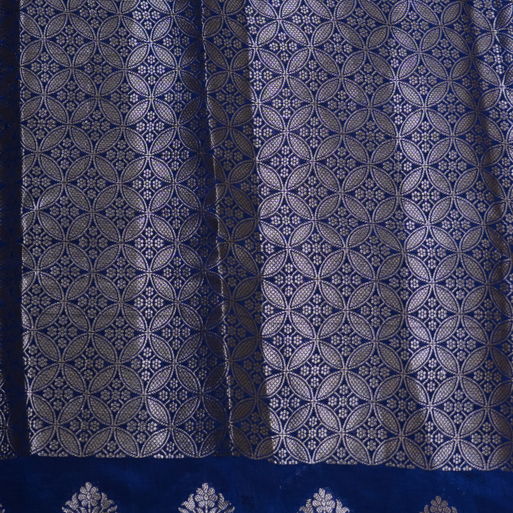 Elegant Banarasi Munga silk saree suitable for weddings and grand celebrations with intricate zari detailing.