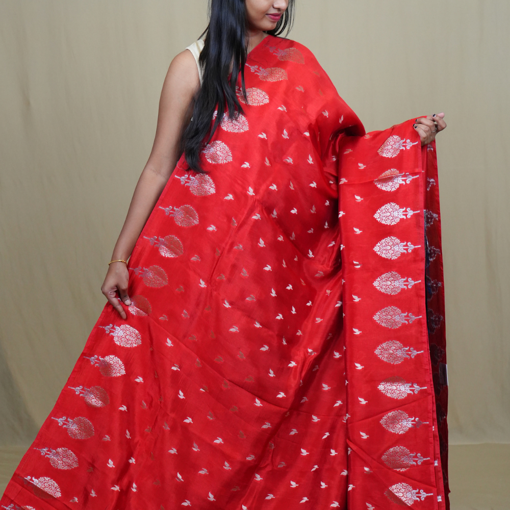 Traditional Banarasi silk saree featuring rich brocade pallu and matching brocade blouse.

