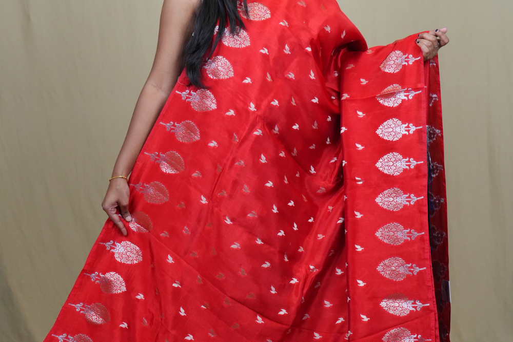 Traditional Banarasi silk saree featuring rich brocade pallu and matching brocade blouse.
