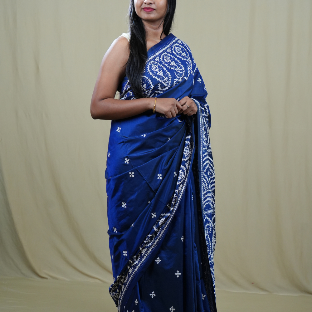 Traditional semi silk saree featuring beautiful hand Kutch work borders and artistic design.

