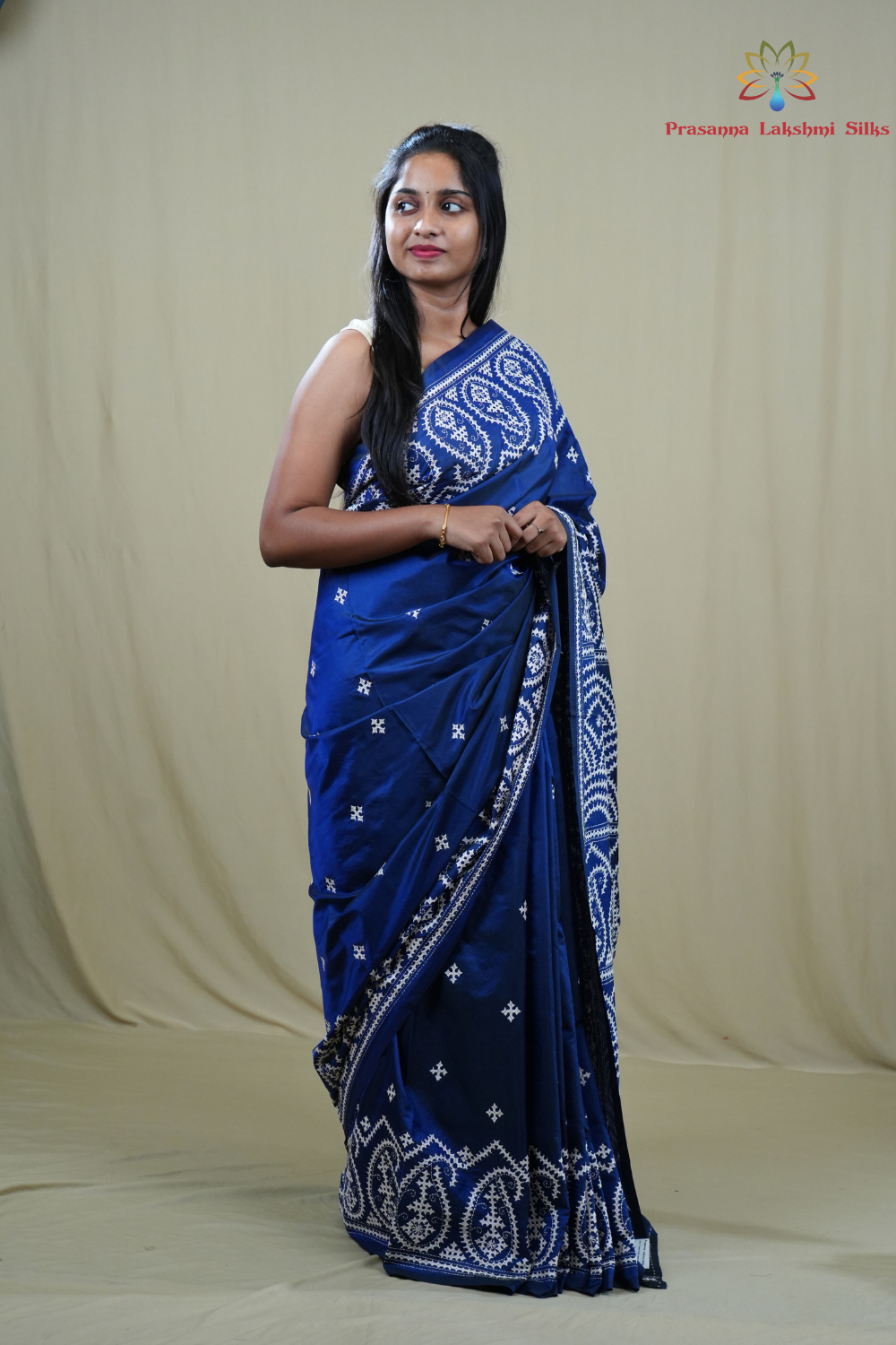Traditional semi silk saree featuring beautiful hand Kutch work borders and artistic design.
