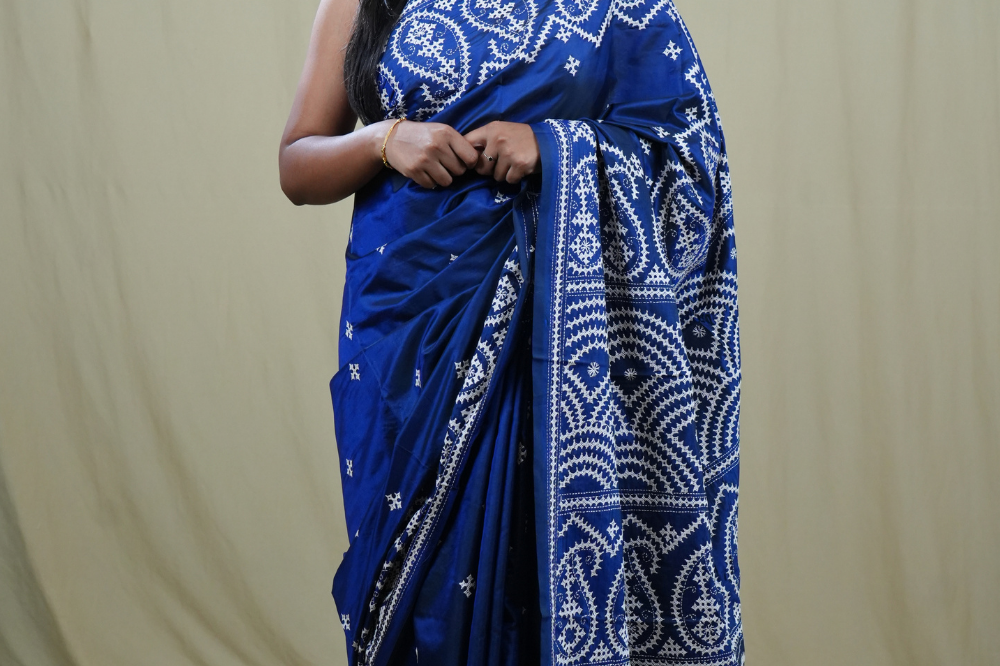 Semi Bangalore Silk Saree with all-over Kutch work motifs and rich embroidered pallu.
